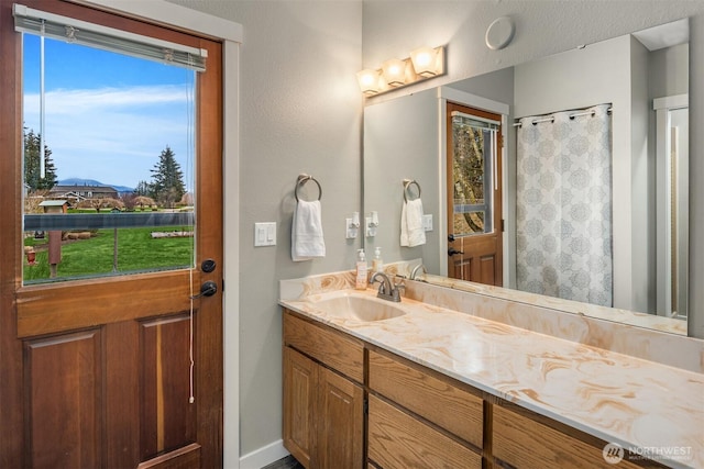 bathroom with vanity and a shower with curtain