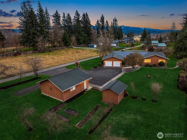 birds eye view of property with a mountain view