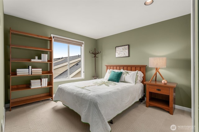 carpeted bedroom with baseboards