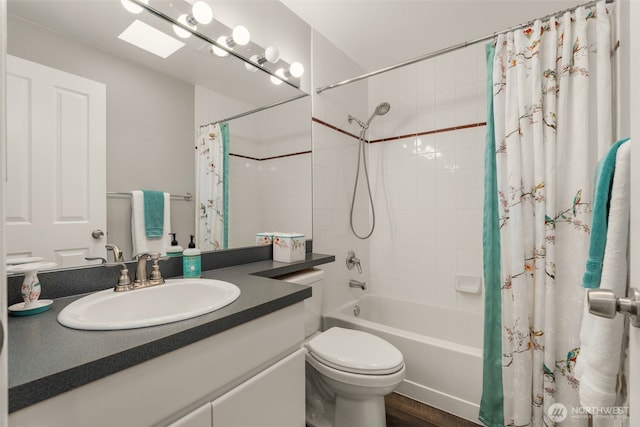 bathroom with wood finished floors, toilet, vanity, and shower / bathtub combination with curtain