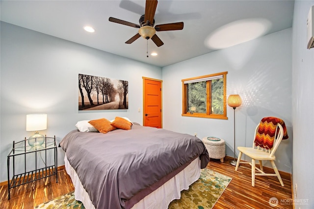 bedroom with recessed lighting, baseboards, wood finished floors, and a ceiling fan