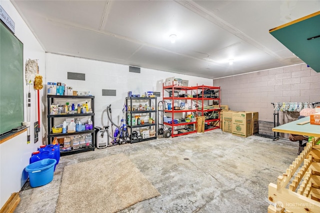 garage with concrete block wall