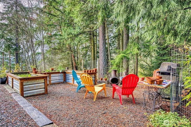 view of yard with an outdoor fire pit