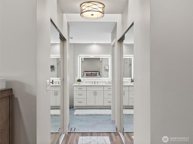 bathroom featuring vanity and wood finished floors