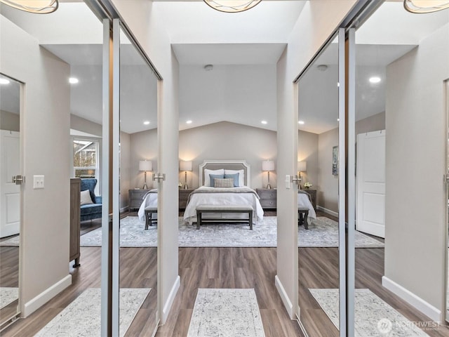 bedroom featuring vaulted ceiling, recessed lighting, baseboards, and wood finished floors