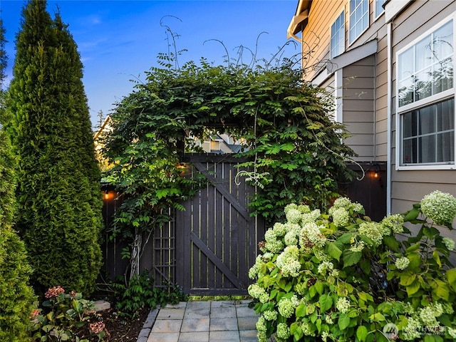 view of property exterior featuring a gate