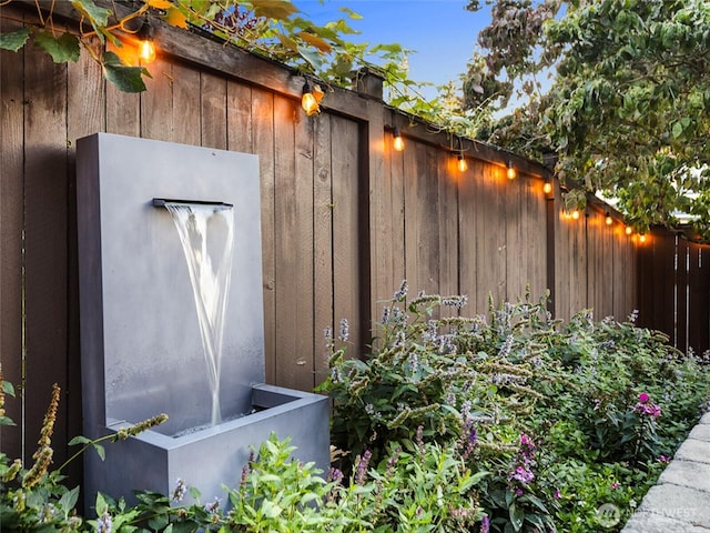 view of outbuilding featuring fence