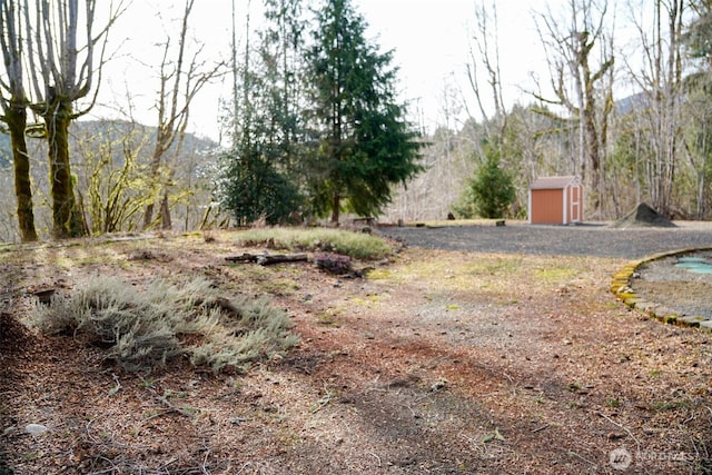 610 N Duckabush Dr N, Hoodsport, WA 98548 - view of yard featuring an outbuilding and a storage unit