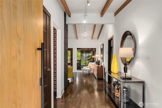 hallway with beam ceiling and wood finished floors