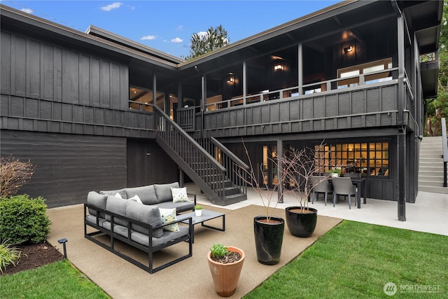 view of patio / terrace with outdoor lounge area and stairway