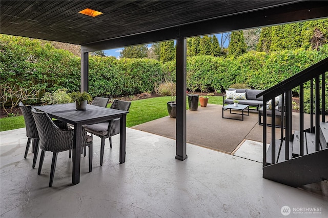 view of patio with an outdoor living space and outdoor dining area