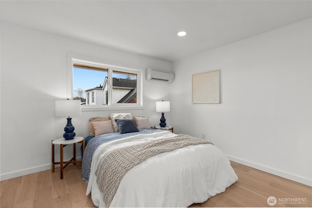 bedroom with recessed lighting, a wall mounted AC, baseboards, and wood finished floors