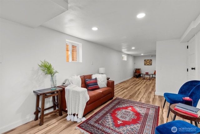 living area with light wood-style flooring, recessed lighting, and baseboards