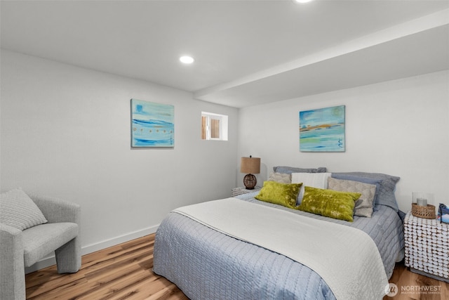 bedroom with recessed lighting, baseboards, and wood finished floors