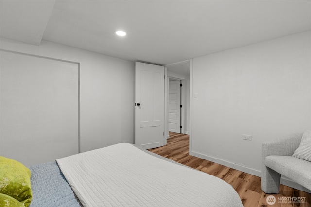 bedroom with recessed lighting, baseboards, and light wood finished floors