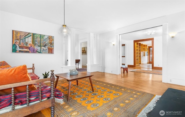 living area with wood finished floors and baseboards