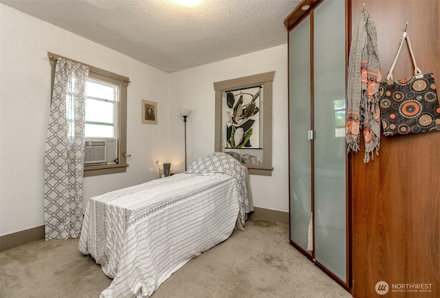 6845 S Clement Ave, Tacoma, WA 98409 - bedroom featuring carpet floors, cooling unit, a textured ceiling, and baseboards