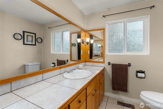 bathroom featuring tile patterned floors, visible vents, toilet, and vanity