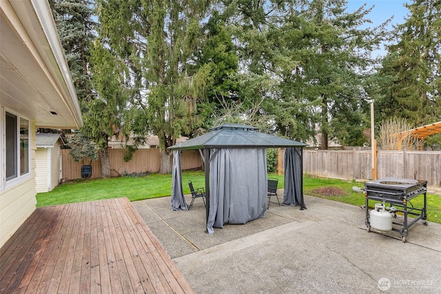 view of patio featuring a gazebo and a fenced backyard