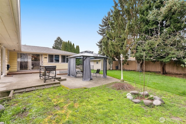 view of yard with a gazebo, fence, and a patio area