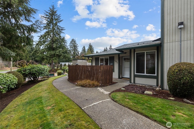 exterior space with a yard and fence