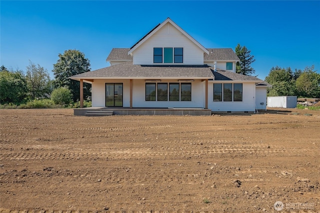 rear view of house with a porch, roof with shingles, and crawl space