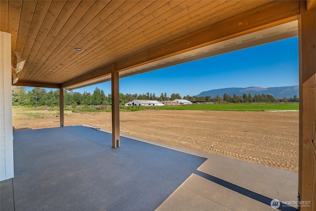 view of patio / terrace with a mountain view