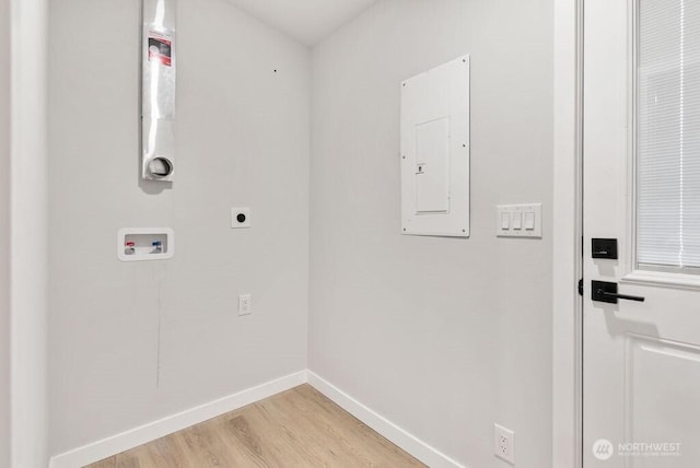 washroom featuring hookup for a washing machine, baseboards, laundry area, electric panel, and electric dryer hookup