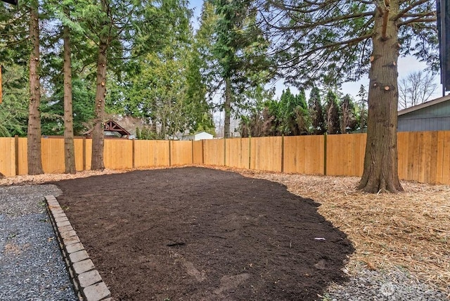 view of yard featuring a fenced backyard