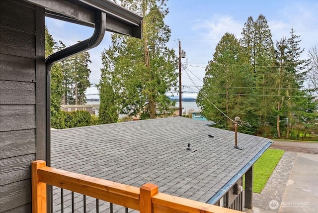 exterior details with roof with shingles