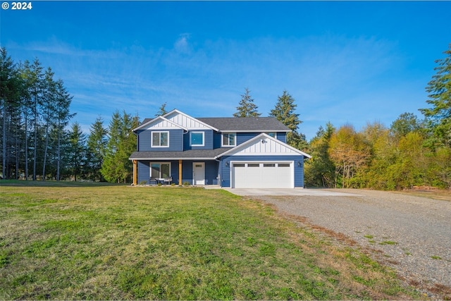 view of front of home with a front lawn, a garage, board and batten siding, and driveway