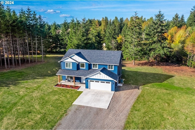 traditional-style home featuring board and batten siding, a shingled roof, a front lawn, concrete driveway, and a garage