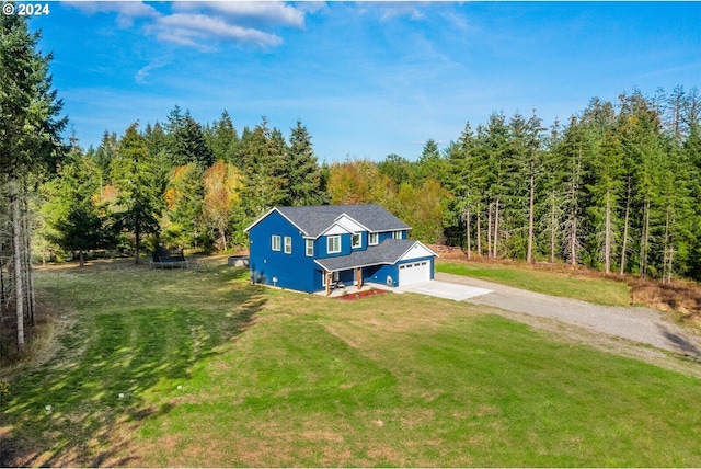 bird's eye view featuring a wooded view