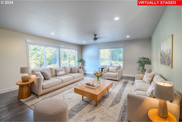 living room with recessed lighting, baseboards, and wood finished floors