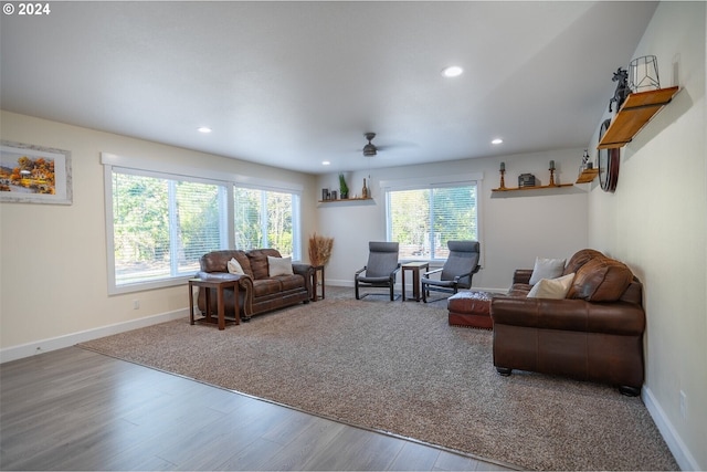 living room with recessed lighting, wood finished floors, and baseboards