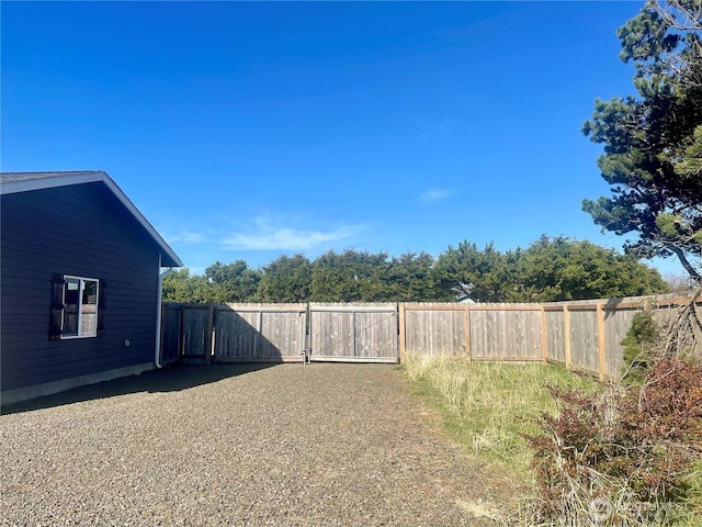 view of yard featuring a gate and fence