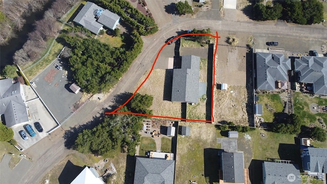 birds eye view of property with a residential view