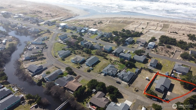 aerial view featuring a residential view and a water view