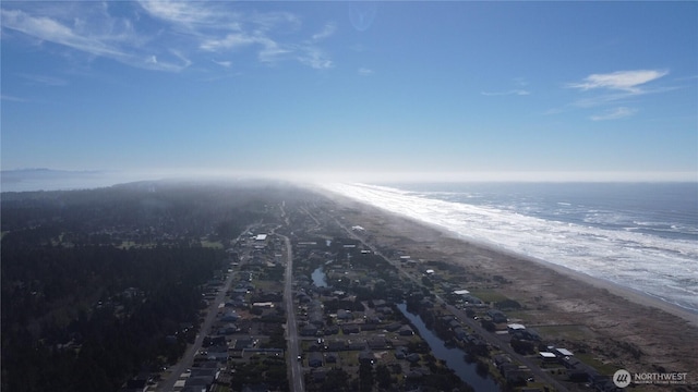 bird's eye view featuring a water view and a view of the beach