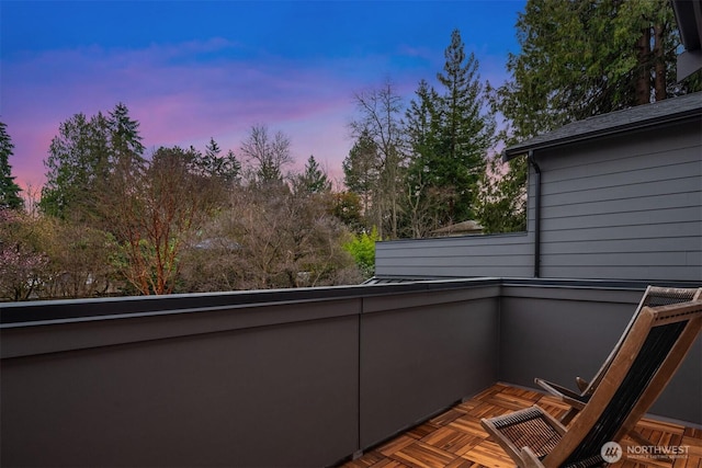 view of balcony at dusk