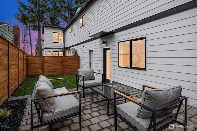 view of patio / terrace with an outdoor living space and a fenced backyard