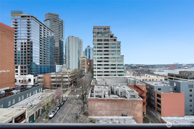 property's view of city featuring a water view