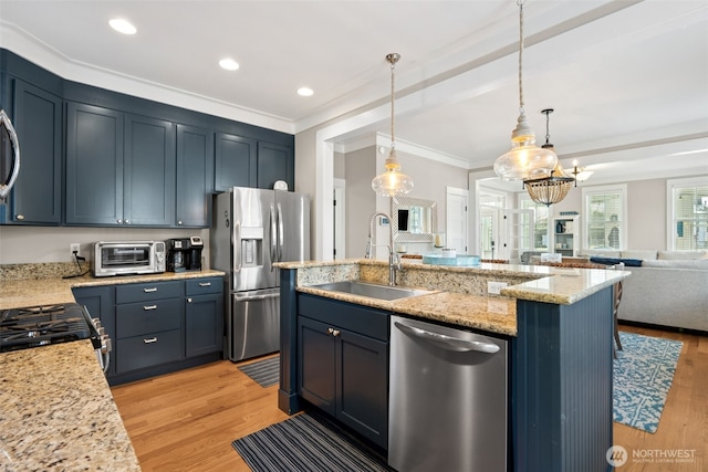 221 Meriweather St, Pacific Beach, WA 98571 - kitchen featuring crown molding, a toaster, open floor plan, stainless steel appliances, and a sink