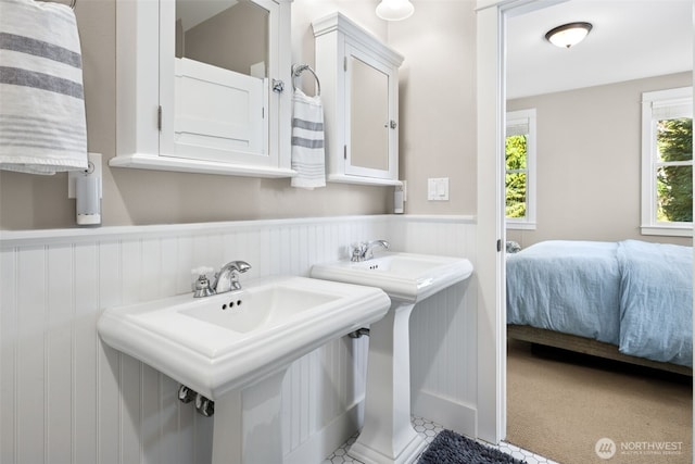221 Meriweather St, Pacific Beach, WA 98571 - bathroom featuring a sink, ensuite bathroom, and wainscoting