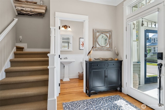 221 Meriweather St, Pacific Beach, WA 98571 - interior space featuring light wood finished floors, wainscoting, and stairs