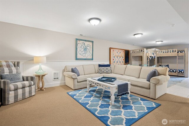 221 Meriweather St, Pacific Beach, WA 98571 - living room featuring heating unit, visible vents, a wainscoted wall, and carpet floors