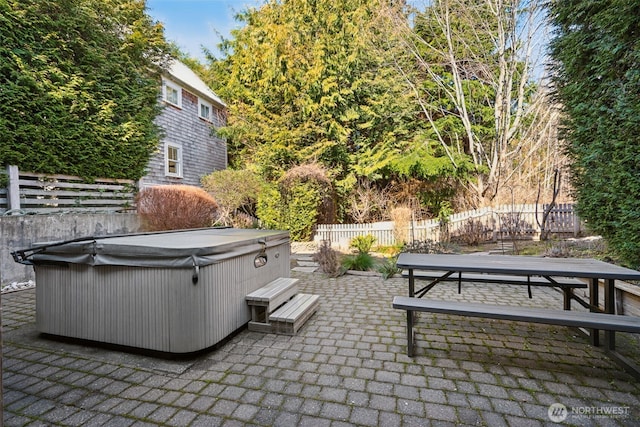 221 Meriweather St, Pacific Beach, WA 98571 - view of patio / terrace featuring outdoor dining area, fence, and a hot tub