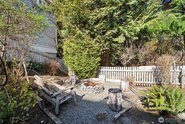 221 Meriweather St, Pacific Beach, WA 98571 - view of patio with fence and an outdoor fire pit
