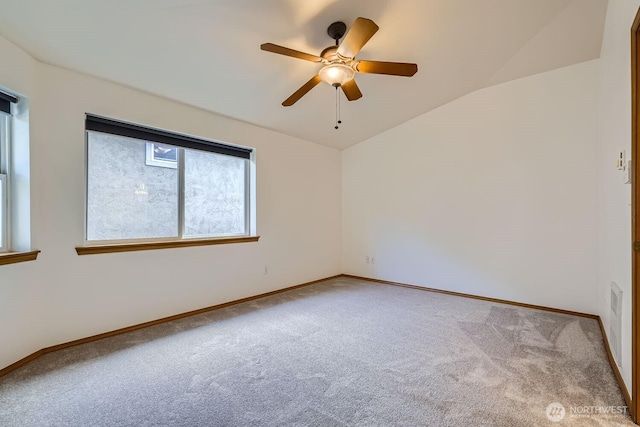 unfurnished room with baseboards, carpet floors, and vaulted ceiling