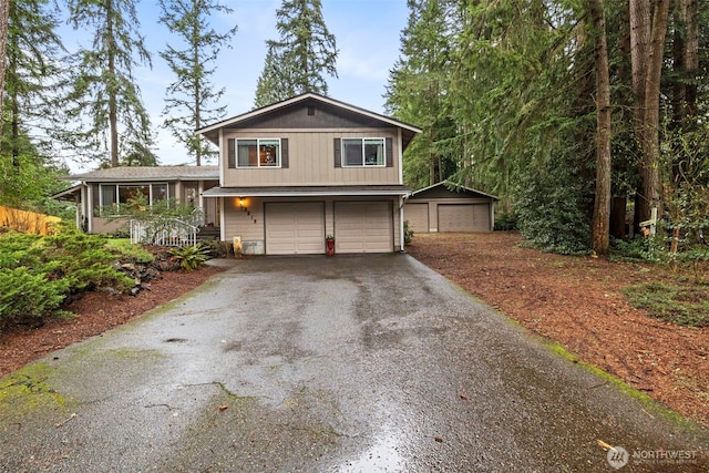 tri-level home with driveway and a garage